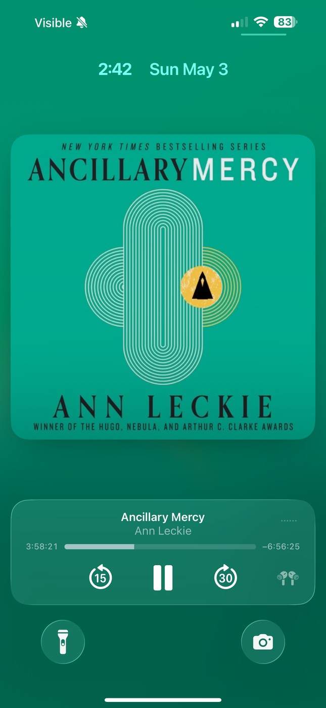 Spine Live Activity on the iOS Lock Screen with cover, chapter title, and progress bar